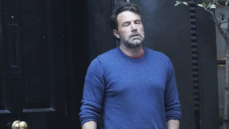ben affleck smoking with a blue cardigan